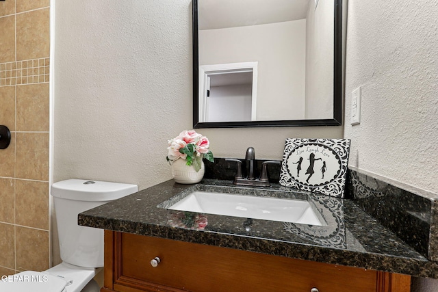 125 N Nevarez Rd, Socorro, TX 79927 - bathroom with vanity and a textured wall