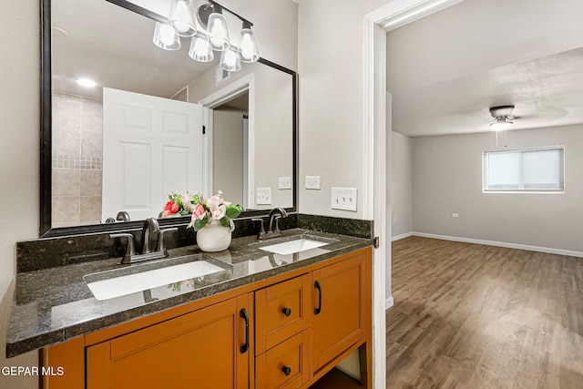 125 N Nevarez Rd, Socorro, TX 79927 - bathroom with wood finished floors and double vanity