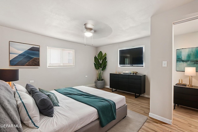125 N Nevarez Rd, Socorro, TX 79927 - bedroom with light wood-type flooring and ceiling fan