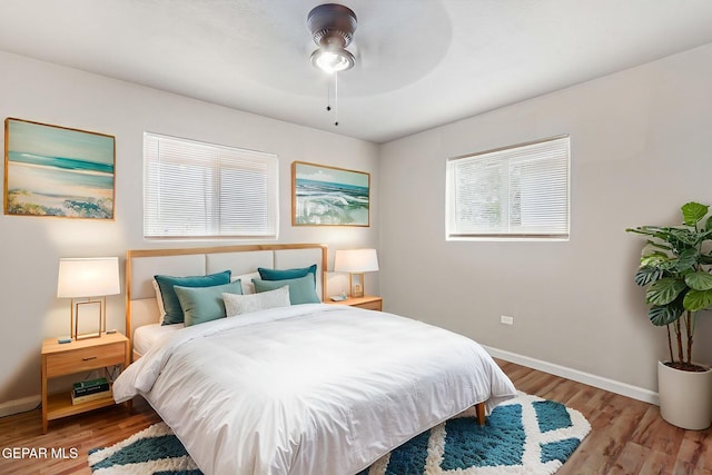 125 N Nevarez Rd, Socorro, TX 79927 - bedroom featuring wood finished floors, multiple windows, and a ceiling fan
