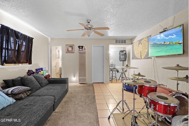 4330 Frankfort Ave, El Paso, TX 79903 - carpeted living area with a heating unit, a ceiling fan, and a textured ceiling