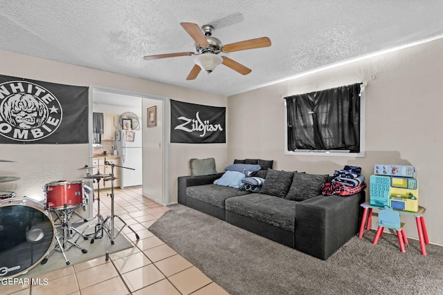 4330 Frankfort Ave, El Paso, TX 79903 - living area with ceiling fan, a textured ceiling, and tile patterned floors