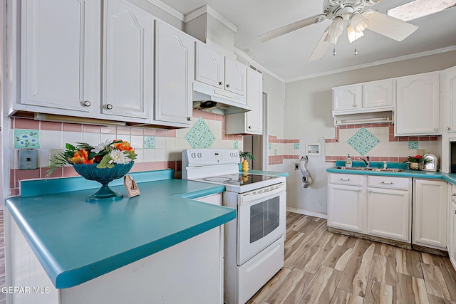 4330 Frankfort Ave, El Paso, TX 79903 - kitchen featuring white electric stove, under cabinet range hood, white cabinets, ceiling fan, and crown molding