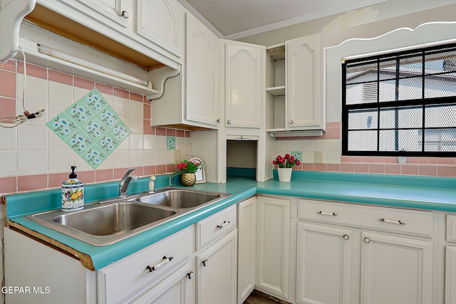 4330 Frankfort Ave, El Paso, TX 79903 - kitchen featuring backsplash, open shelves, and white cabinetry