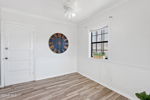 4330 Frankfort Ave, El Paso, TX 79903 - unfurnished room featuring ceiling fan, wood finished floors, ornamental molding, and a wainscoted wall