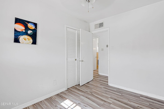 4330 Frankfort Ave, El Paso, TX 79903 - unfurnished bedroom featuring light wood-style floors, a closet, and ceiling fan