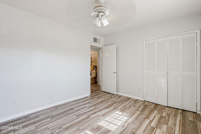 4330 Frankfort Ave, El Paso, TX 79903 - unfurnished bedroom featuring light wood finished floors, a closet, and a ceiling fan