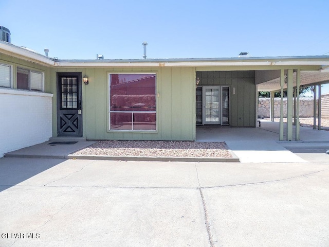 2721 Fir St, El Paso, TX 79925 - property entrance featuring board and batten siding
