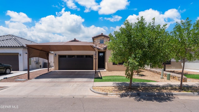 13597 Gatton St, El Paso, TX 79928 - view of front of home with stucco siding, a garage, and driveway