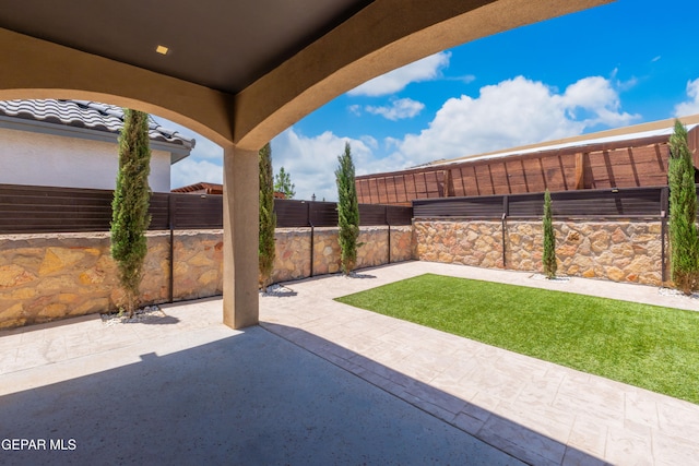 13597 Gatton St, El Paso, TX 79928 - fenced backyard with a patio area