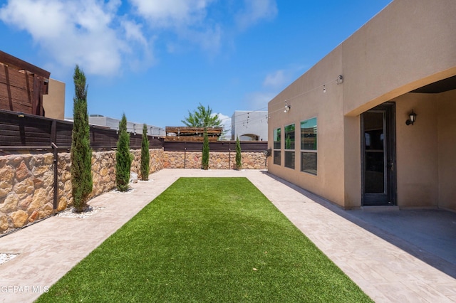 13597 Gatton St, El Paso, TX 79928 - fenced backyard with a patio