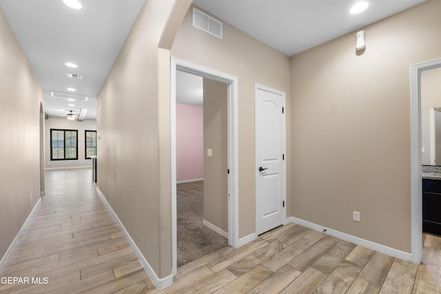 13597 Gatton St, El Paso, TX 79928 - hall with light wood-style flooring, recessed lighting, and arched walkways