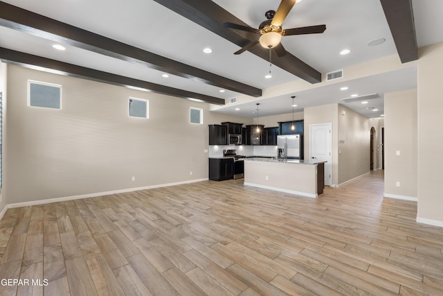 13597 Gatton St, El Paso, TX 79928 - unfurnished living room with beam ceiling, ceiling fan, light wood-style flooring, recessed lighting, and arched walkways