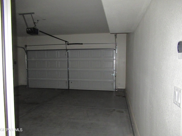 2813 Mike Price Dr, El Paso, TX 79938 - garage with a garage door opener and a textured wall