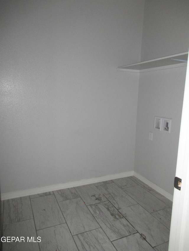 2813 Mike Price Dr, El Paso, TX 79938 - laundry area with marble look tiles and washer hookup