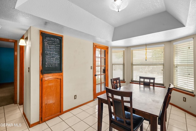 11960 Francis Scobee Dr, El Paso, TX 79936 - dining area featuring a textured ceiling, plenty of natural light, and light tile patterned floors