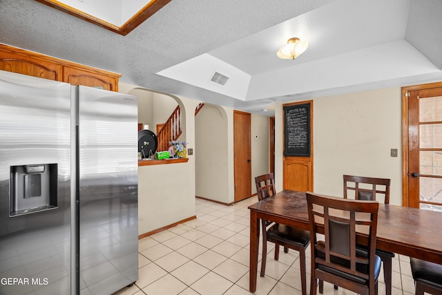 11960 Francis Scobee Dr, El Paso, TX 79936 - dining area featuring a tray ceiling and light tile patterned floors