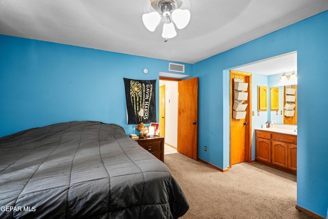11960 Francis Scobee Dr, El Paso, TX 79936 - carpeted bedroom with a ceiling fan and ensuite bathroom