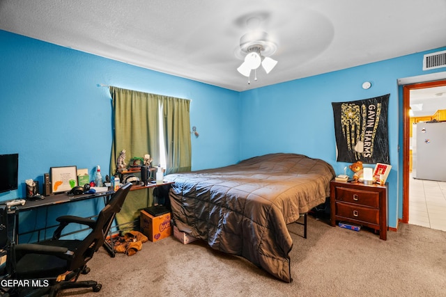 11960 Francis Scobee Dr, El Paso, TX 79936 - bedroom with freestanding refrigerator, carpet, and ceiling fan