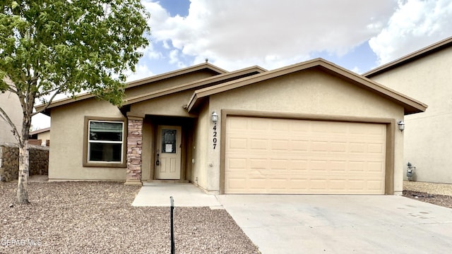 14207 Ranier Point Dr, El Paso, TX 79938 - ranch-style home featuring stucco siding, an attached garage, and driveway