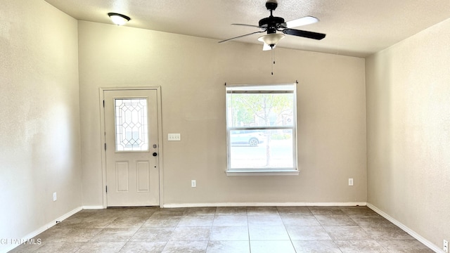 14207 Ranier Point Dr, El Paso, TX 79938 - entrance foyer featuring a ceiling fan, a textured ceiling, tile patterned floors, and vaulted ceiling