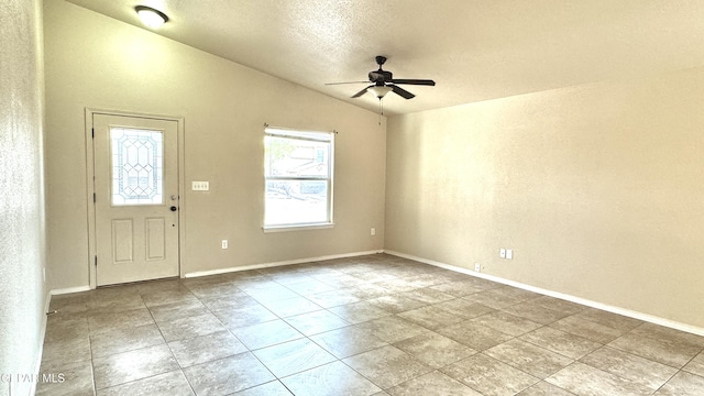 14207 Ranier Point Dr, El Paso, TX 79938 - tiled foyer entrance with ceiling fan, vaulted ceiling, and a textured ceiling