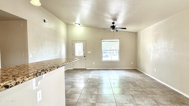 14207 Ranier Point Dr, El Paso, TX 79938 - unfurnished dining area with ceiling fan, a textured ceiling, and light tile patterned flooring