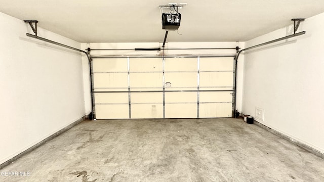 14207 Ranier Point Dr, El Paso, TX 79938 - garage with a garage door opener and baseboards