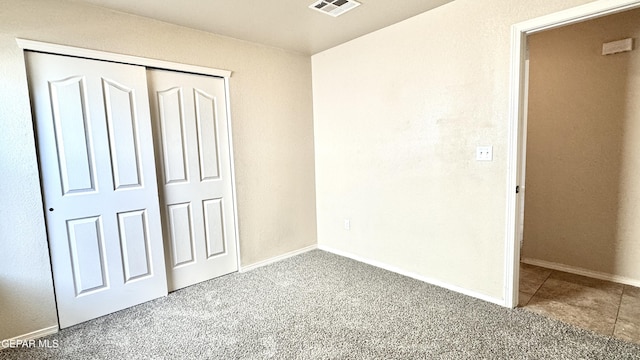 14207 Ranier Point Dr, El Paso, TX 79938 - unfurnished bedroom featuring carpet flooring and a closet