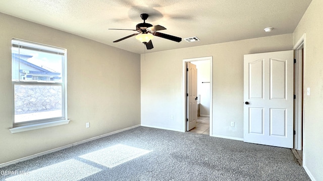 14207 Ranier Point Dr, El Paso, TX 79938 - unfurnished bedroom featuring carpet, a textured ceiling, and ceiling fan