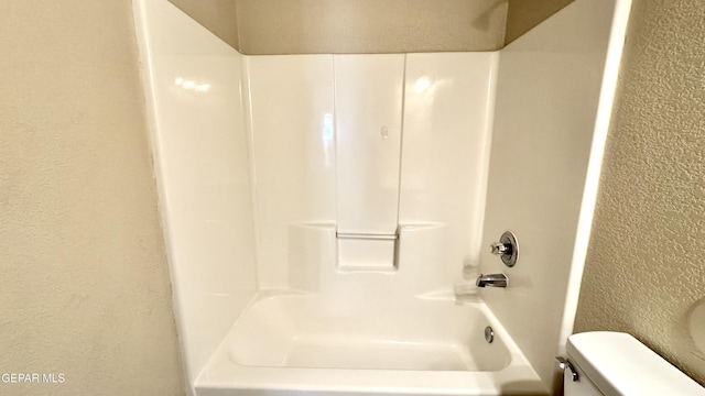 14207 Ranier Point Dr, El Paso, TX 79938 - bathroom with a textured wall and shower / bathtub combination