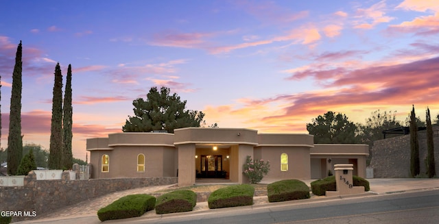 1349 Belvidere St, El Paso, TX 79912 - art deco house with stucco siding, concrete driveway, and a garage