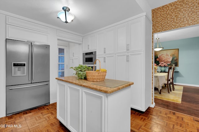 1349 Belvidere St, El Paso, TX 79912 - kitchen with appliances with stainless steel finishes, white cabinets, a center island, and light stone counters