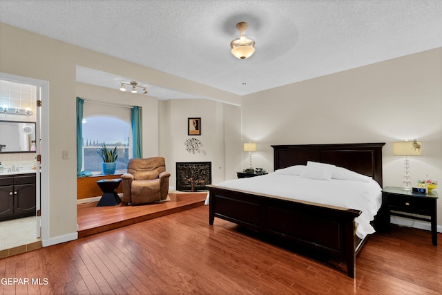 1349 Belvidere St, El Paso, TX 79912 - bedroom with hardwood / wood-style flooring and a textured ceiling