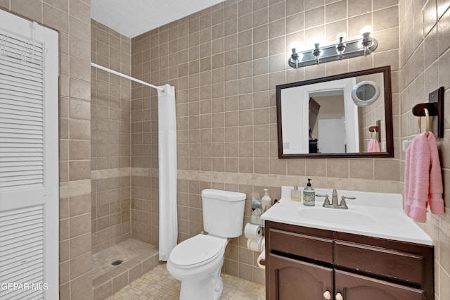 1349 Belvidere St, El Paso, TX 79912 - full bathroom featuring tile walls, vanity, tiled shower, and tile patterned flooring