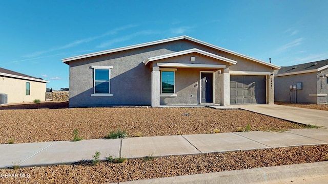 14661 Holly Blue Ave, Horizon City, TX 79928 - ranch-style home featuring a garage, concrete driveway, and stucco siding