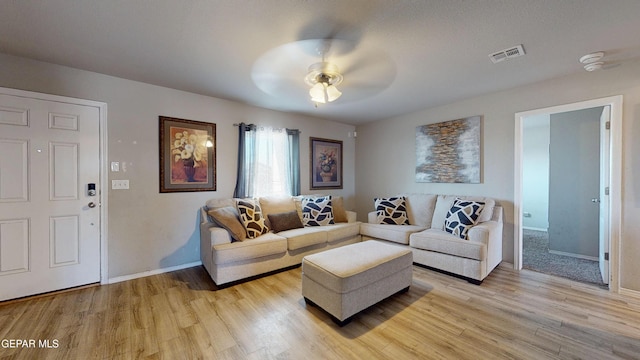 14661 Holly Blue Ave, Horizon City, TX 79928 - living area featuring light wood-style floors and ceiling fan