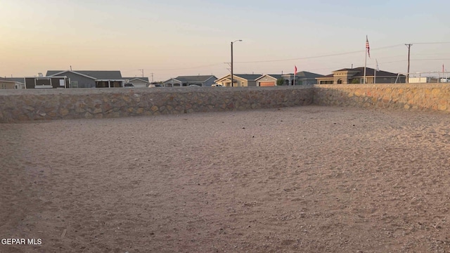 14661 Holly Blue Ave, Horizon City, TX 79928 - yard at dusk with a residential view