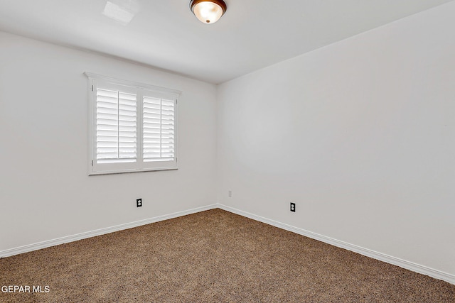 3143 Red Maple, El Paso, TX 79938 - spare room featuring dark colored carpet and baseboards