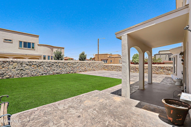 3143 Red Maple, El Paso, TX 79938 - fenced backyard with a patio area