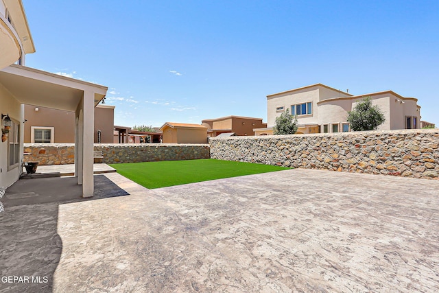 3143 Red Maple, El Paso, TX 79938 - fenced backyard featuring a patio area