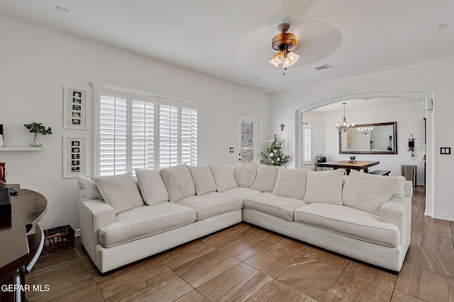 3143 Red Maple, El Paso, TX 79938 - living area featuring arched walkways, a chandelier, and ceiling fan