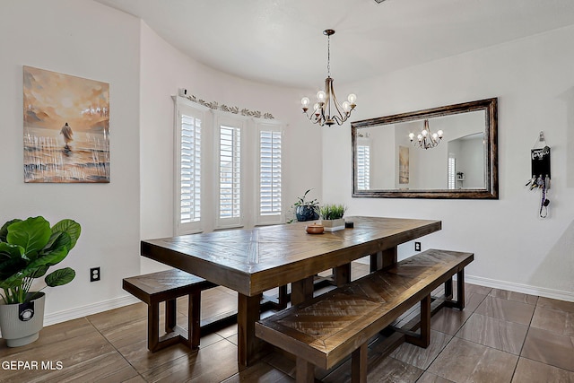 3143 Red Maple, El Paso, TX 79938 - dining area featuring a chandelier and baseboards