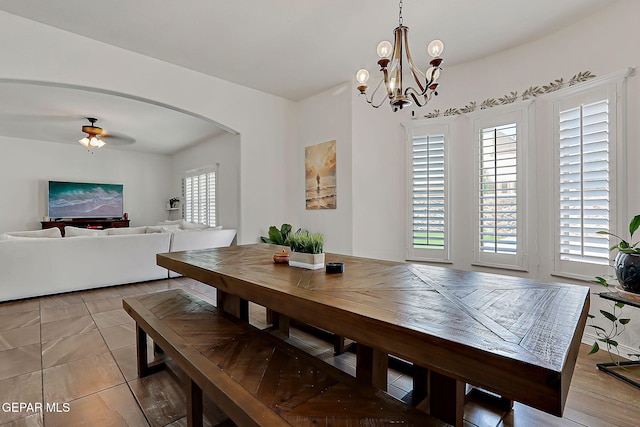 3143 Red Maple, El Paso, TX 79938 - dining room with arched walkways, a chandelier, and a ceiling fan