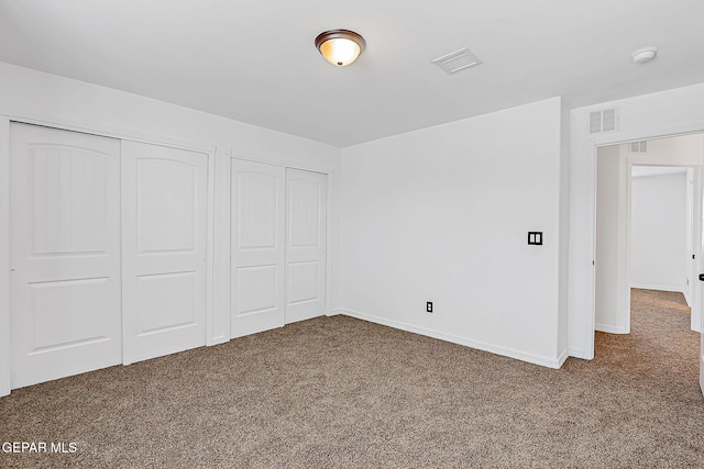 3143 Red Maple, El Paso, TX 79938 - unfurnished bedroom featuring carpet and multiple closets