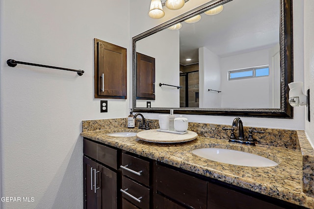 3143 Red Maple, El Paso, TX 79938 - bathroom with double vanity and a shower