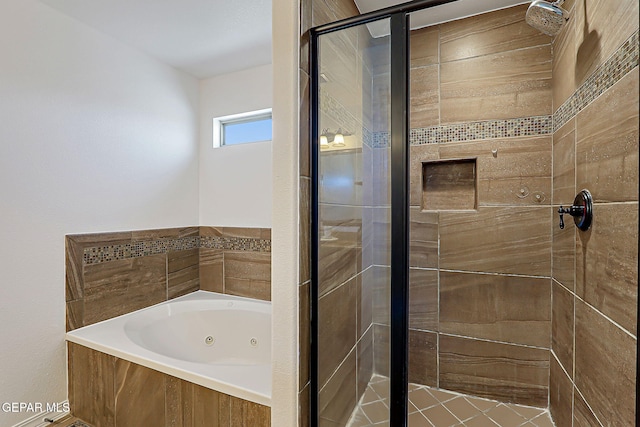 3143 Red Maple, El Paso, TX 79938 - bathroom with a shower stall and a jetted tub