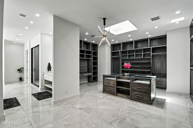 6325 Camino Pinon, El Paso, TX 79932 - home office with light marble finish flooring, built in features, a skylight, and recessed lighting