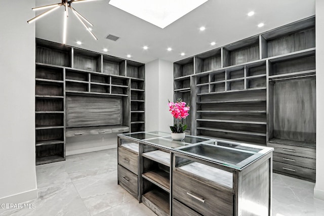 6325 Camino Pinon, El Paso, TX 79932 - spacious closet with light marble finish flooring and a skylight