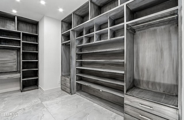 6325 Camino Pinon, El Paso, TX 79932 - walk in closet featuring marble finish floors